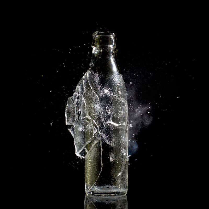 glass bottle getting smashed photo right at the point of impact